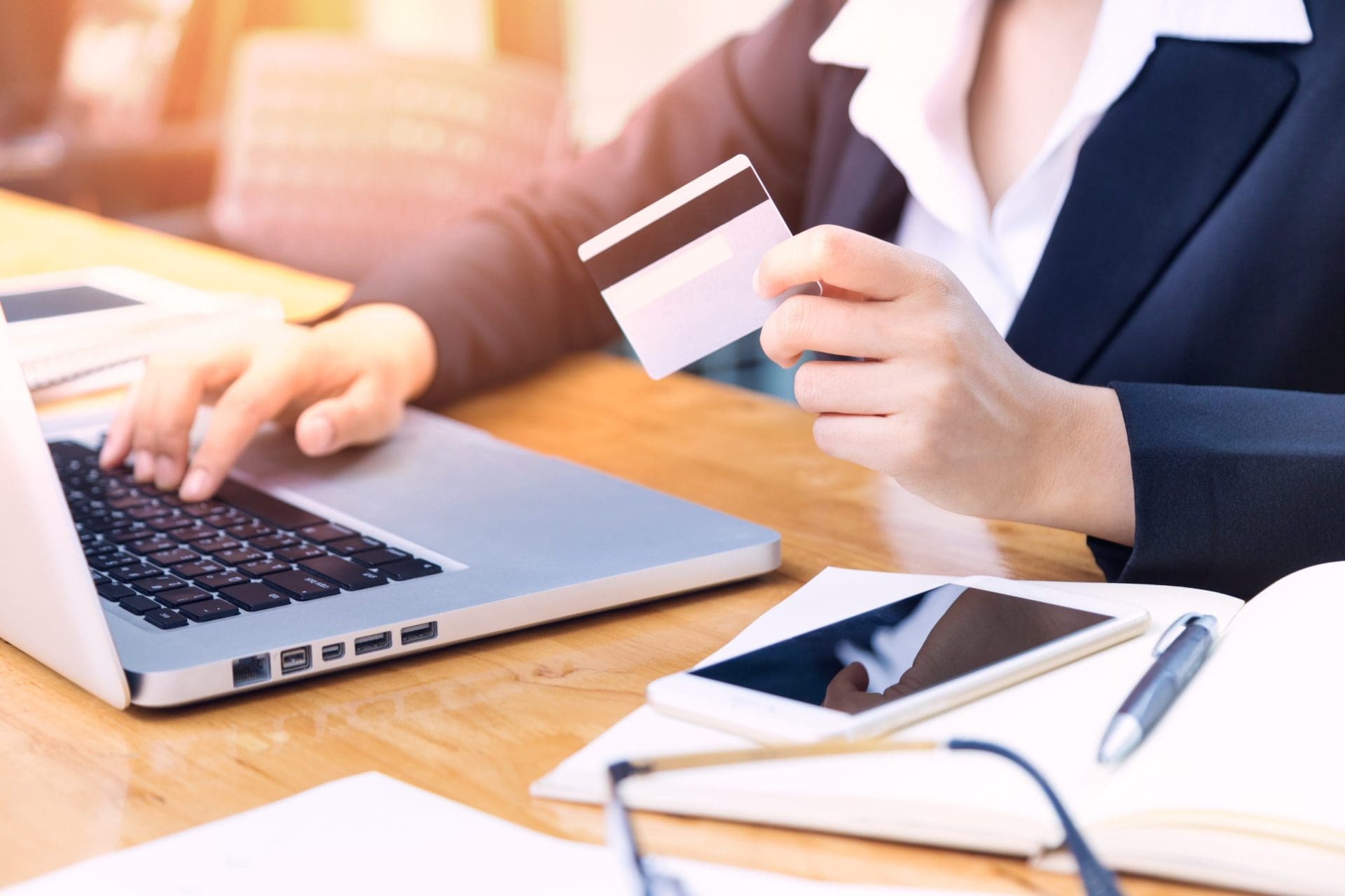 Customer entering payment information during an online purchase on a laptop.