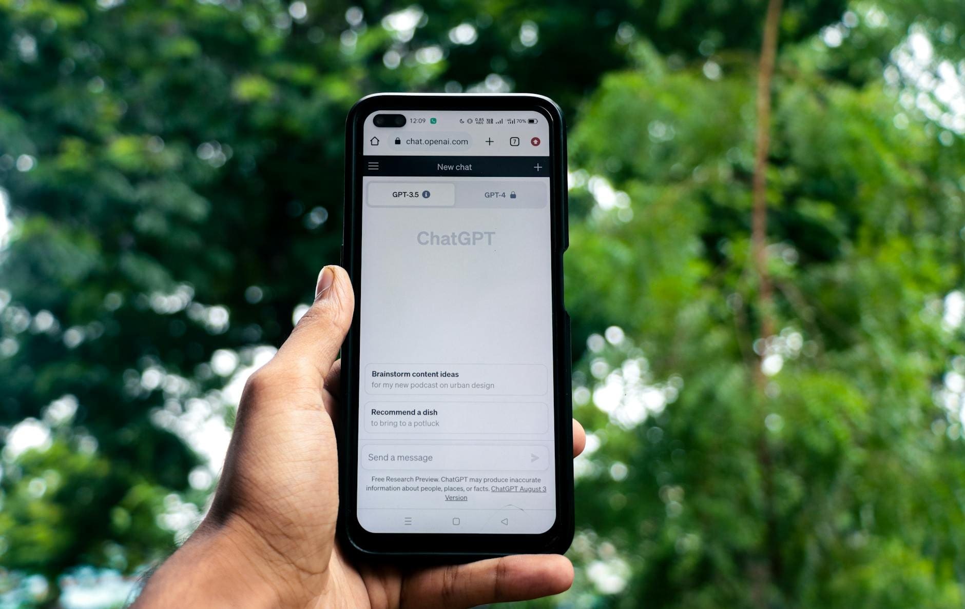 A person holding a smartphone displaying the ChatGPT interface, illustrating mobile-first web design for Decatur businesses.