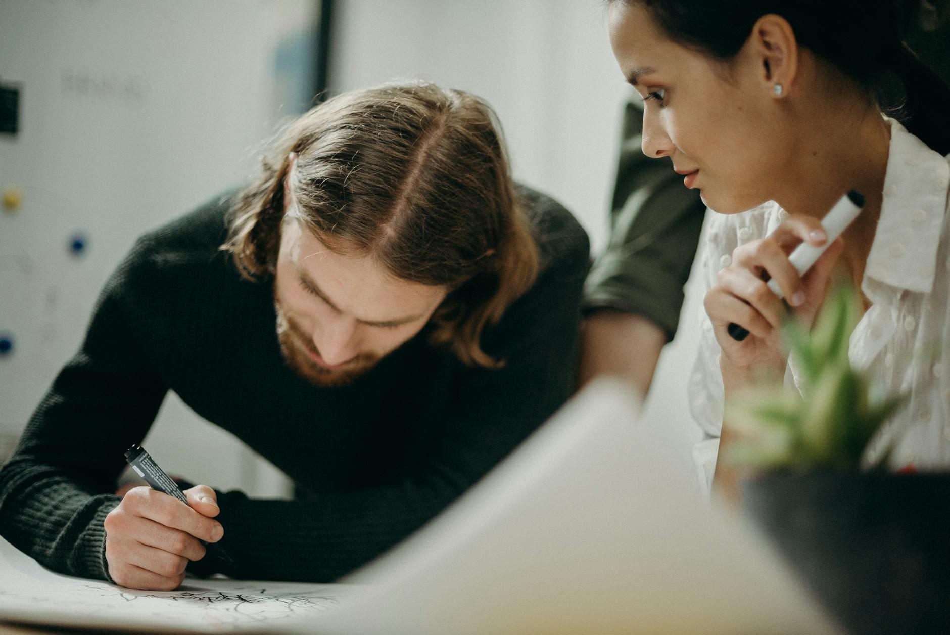 Web Designer Speaking With Business Owner